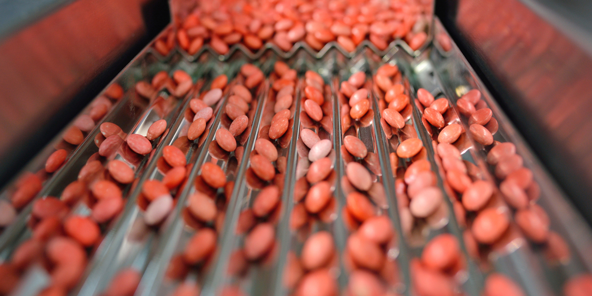 Close-up of the red pill in production line.