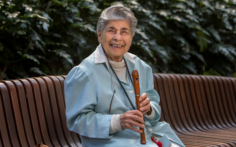 Ruth Moll, Cedars-Sinai volunteer holding her recoreder.