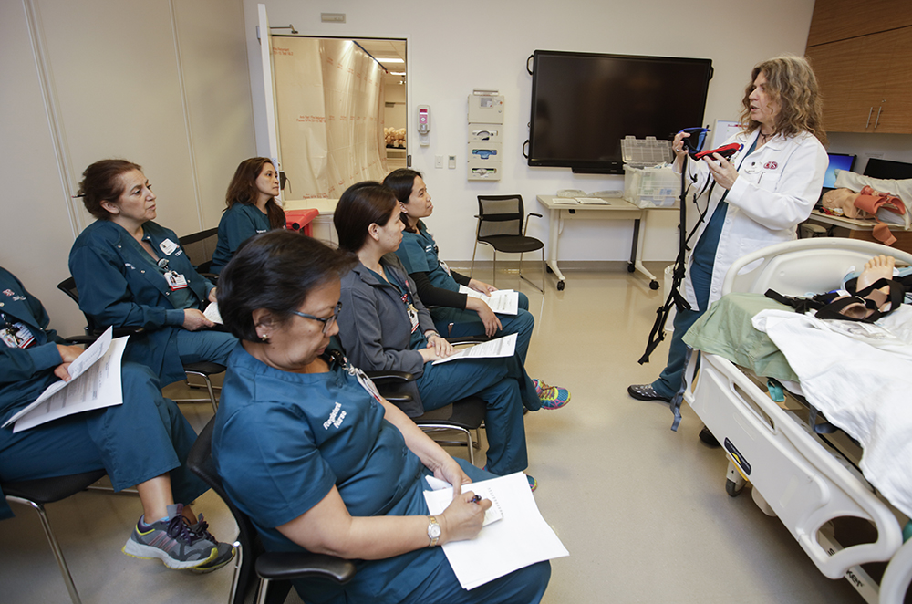 Cedars-Sinai education program coordinator, Karen Silva teaching a group of nurses.