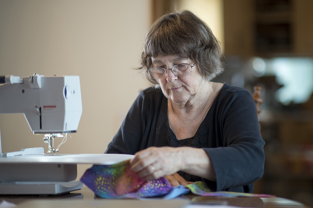 Dorothy Williams sewing a Halloween costume.