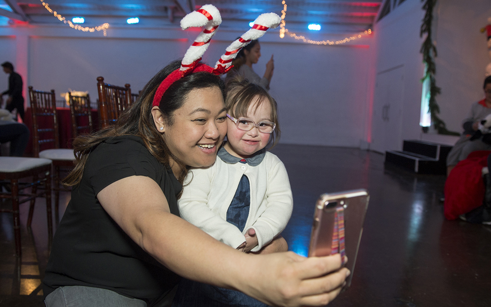 Cedars-Sinai child life specialist Joanne Ordono takes a selfie with patient Áine Randle.
