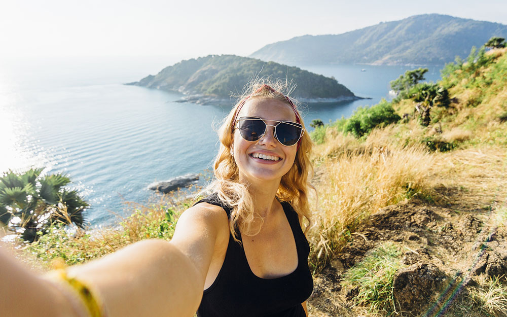 Woman taking a selfie on a hike.