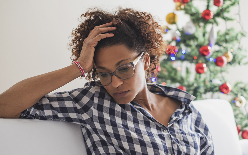 A woman going through stress and depression during holidays.