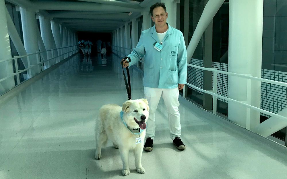 Adam Goldworm and his volunteer therapy dog, Bob Dylan.
