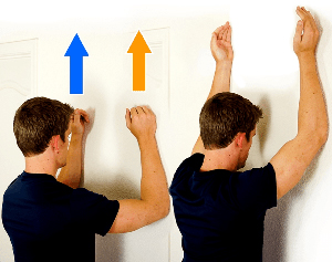 Man doing serratus walle side exercise.