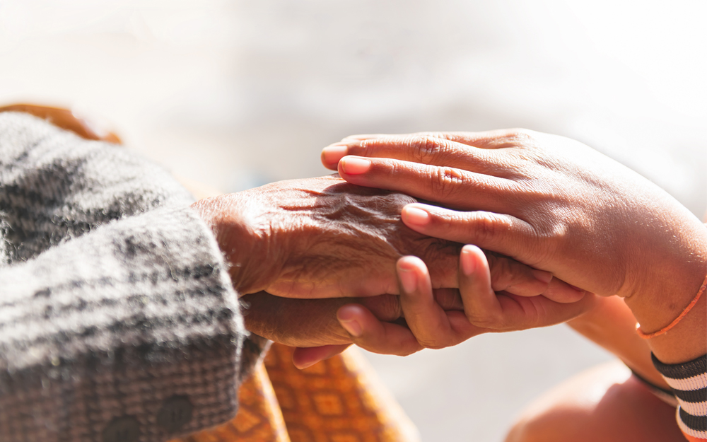 A pair of holding hands for support.