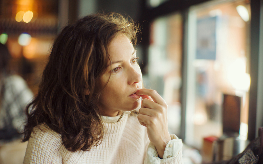 Woman staring off into space.