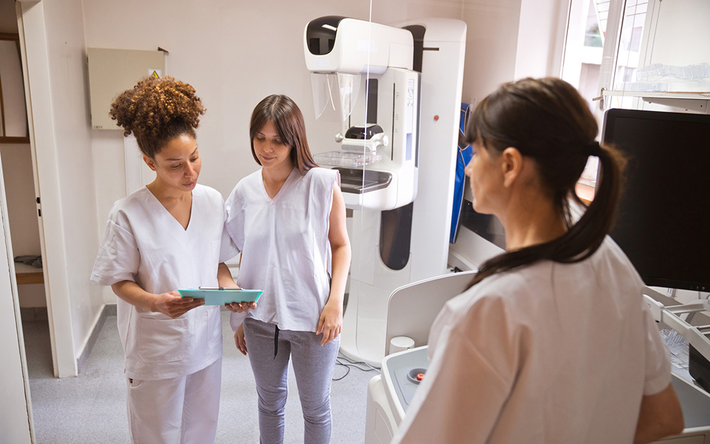 Doctor reviewing mammogram results with her patient