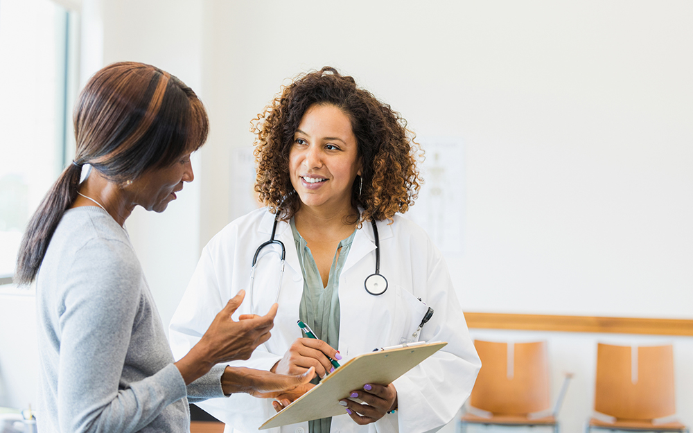 Woman looking at results on an at-home menopause test