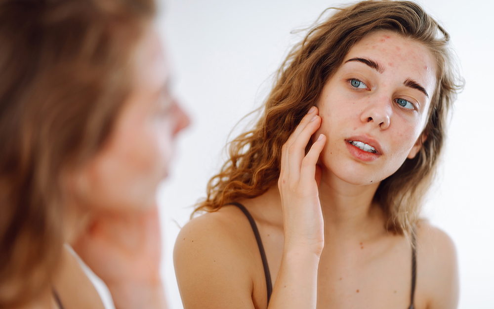 Girl examining her face