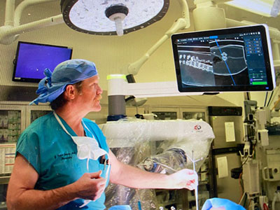 J. Patrick Johnson, MD, performing surgery.