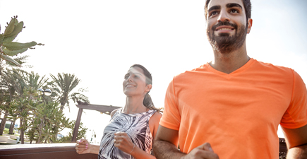 Man and woman jogging.